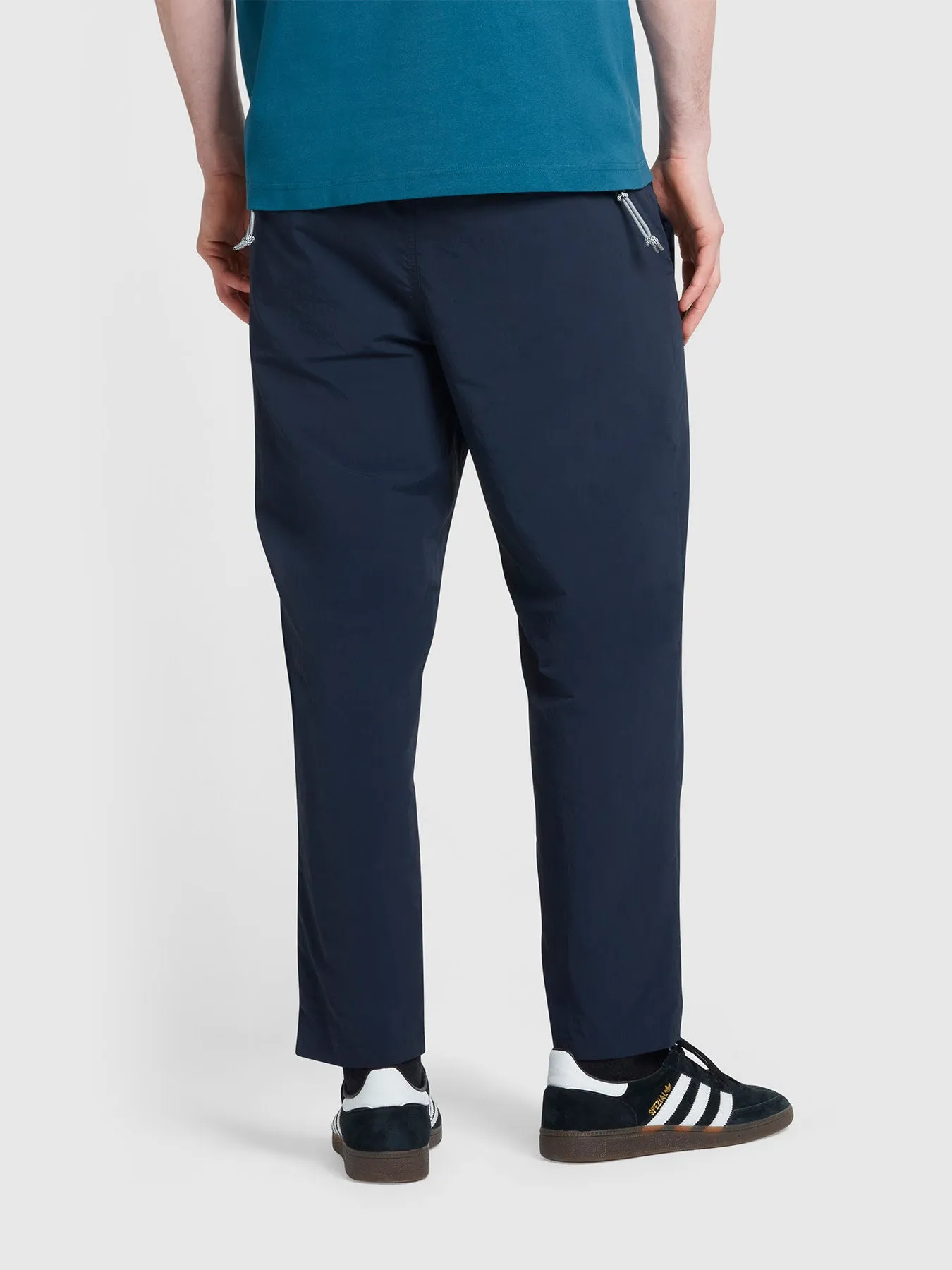 Hawtin Relaxed Tapered Fit Technical Trousers In True Navy